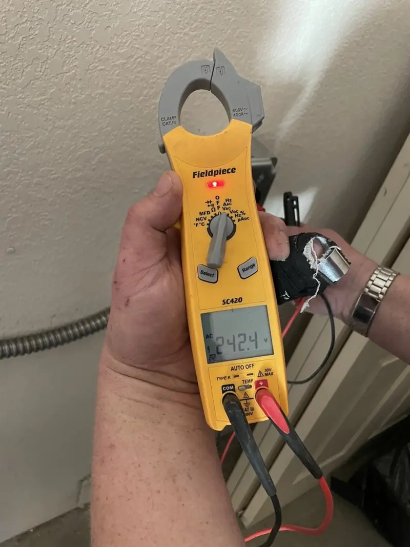 Voltage testing with clamp meter during Electrical Installation Services in Camillus